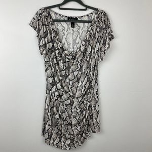 Isabella Rodriguez, Snake skin print blouse.